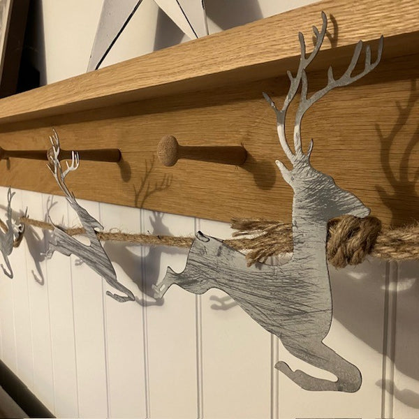 Add this stunning Rustic Reindeer Rope Garland to your cosy home at Christmas time.