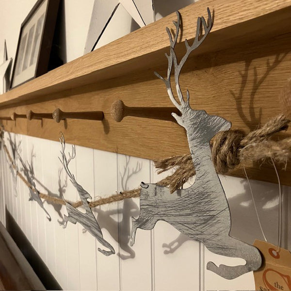 Add this stunning Rustic Reindeer Rope Garland to your cosy home at Christmas time.