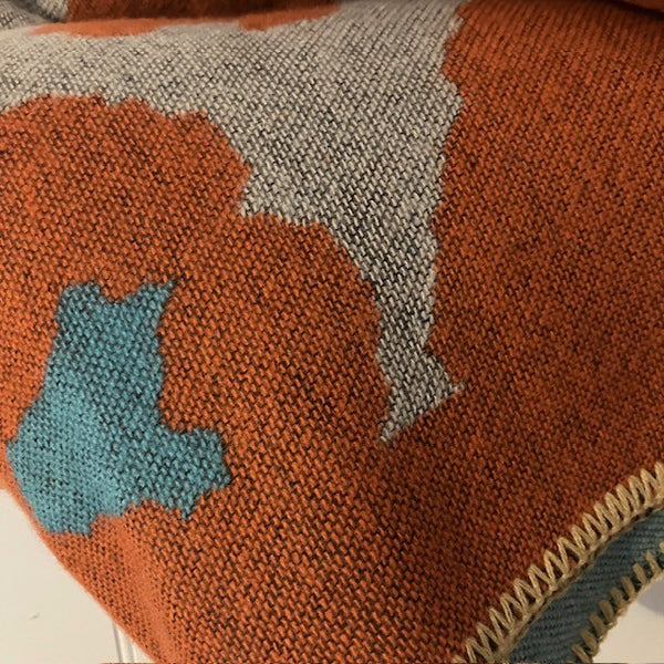 The Etta Cape Rust & Turquoise is an absolutely stunning leopard print accessory to add to your wardrobe