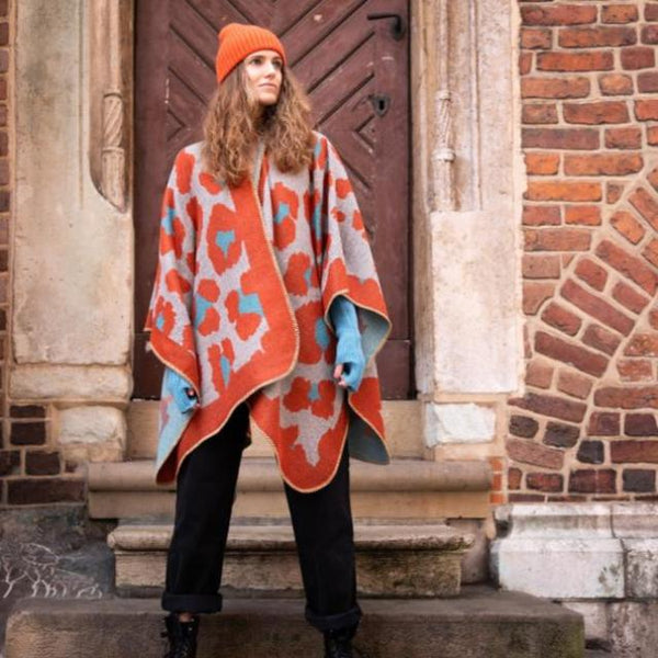 The Etta Cape Rust & Turquoise is an absolutely stunning leopard print accessory to add to your wardrobe