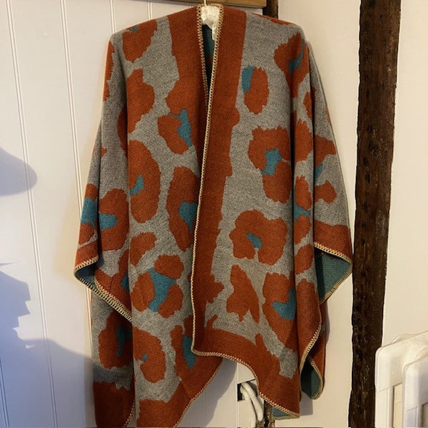 The Etta Cape Rust & Turquoise is an absolutely stunning leopard print accessory to add to your wardrobe