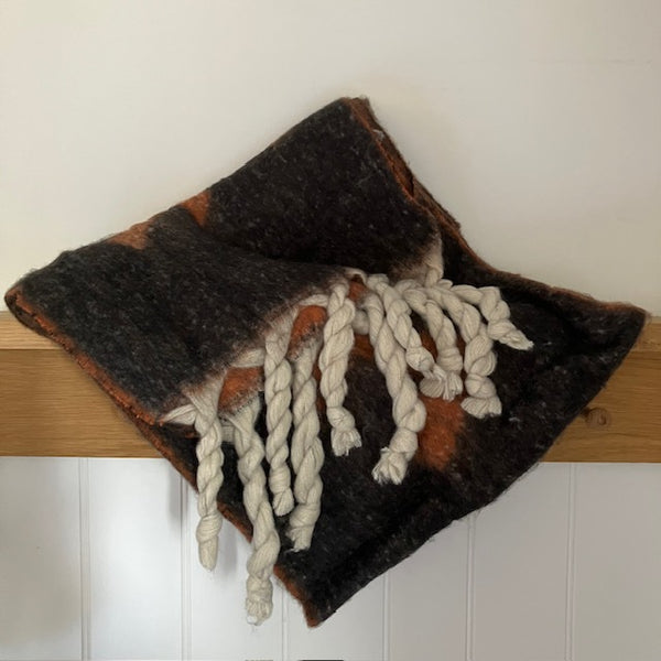 The Frida Scarf Black & Tan is a wonderfully soft, on-trend large statement scarf that will add warmth and character to any outfit