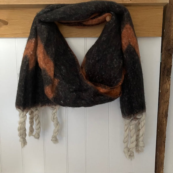 The Frida Scarf Black & Tan is a wonderfully soft, on-trend large statement scarf that will add warmth and character to any outfit