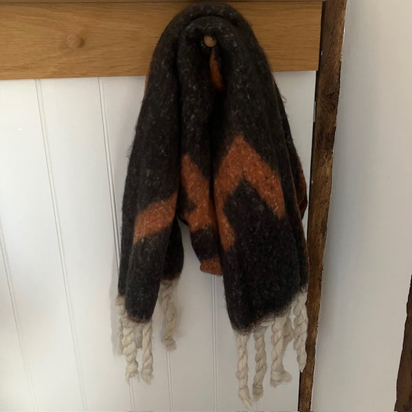 The Frida Scarf Black & Tan is a wonderfully soft, on-trend large statement scarf that will add warmth and character to any outfit