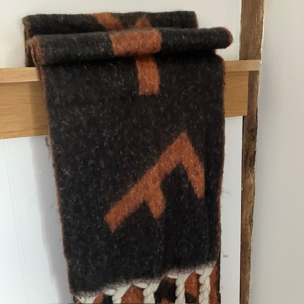 The Frida Scarf Black & Tan is a wonderfully soft, on-trend large statement scarf that will add warmth and character to any outfit