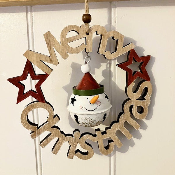 Wooden Christmas decoration with stars and a tin snowman ornament