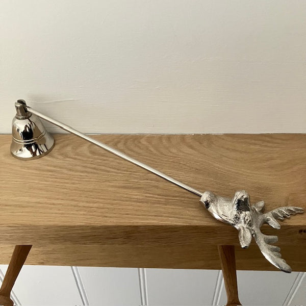 The Stag Candle Snuffer extinguishes a candles flame safely