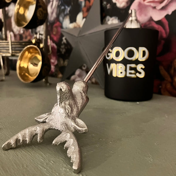 The Stag Candle Snuffer extinguishes a candles flame safely