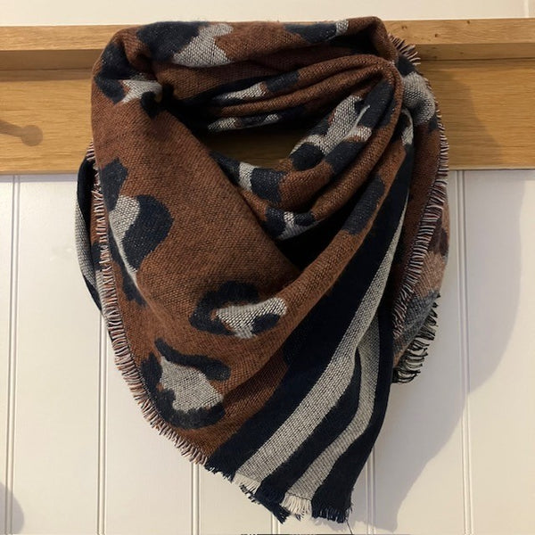 The Wangari Scarf Brown is the perfect statement blanket scarf that will keep you super cosy and warm