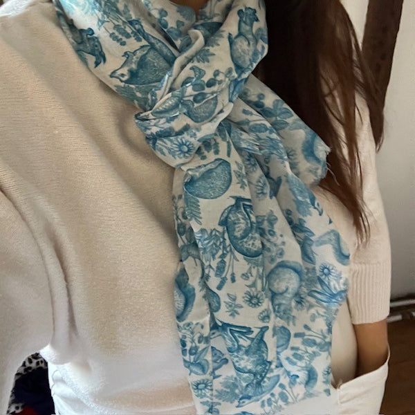 The Cottage Wildlife Scarf Teal is a cosy British cottage garden print including wildlife