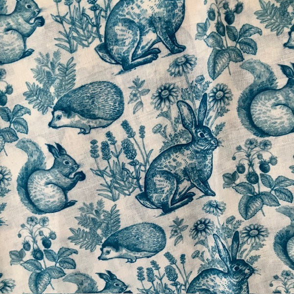 The Cottage Wildlife Scarf Teal is a cosy British cottage garden print including wildlife
