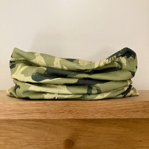 Abella Snood Dinosaurs Green has a fun prehistoric pattern, ideal for dino loving kids to keep them warm and cosy