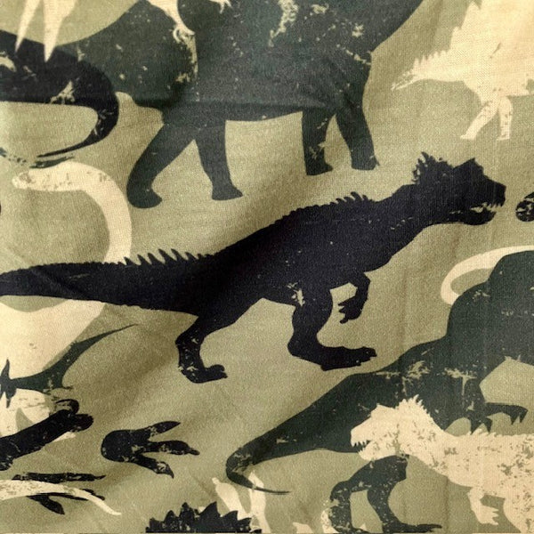 Abella Snood Dinosaurs Green has a fabulous T-Rex, Diplodocus and prehistoric pattern