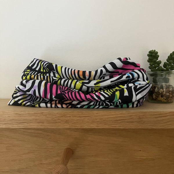 The Abella Snood Rainbow Zebras is a fabulously fun 'actual' zebra print that will add a gorgeous splash of colour to your outfit