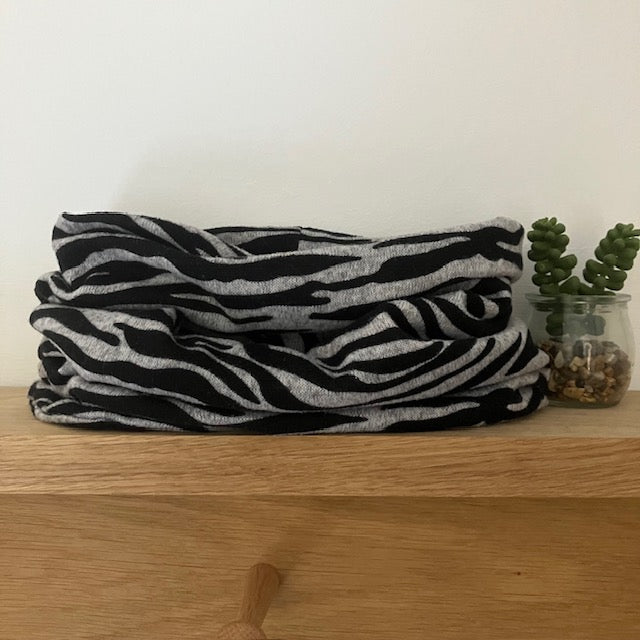 The Abella Snood Zebra Print Black and Grey is the perfect bold on trend print to add to your outfit to keep you cosy and warm 