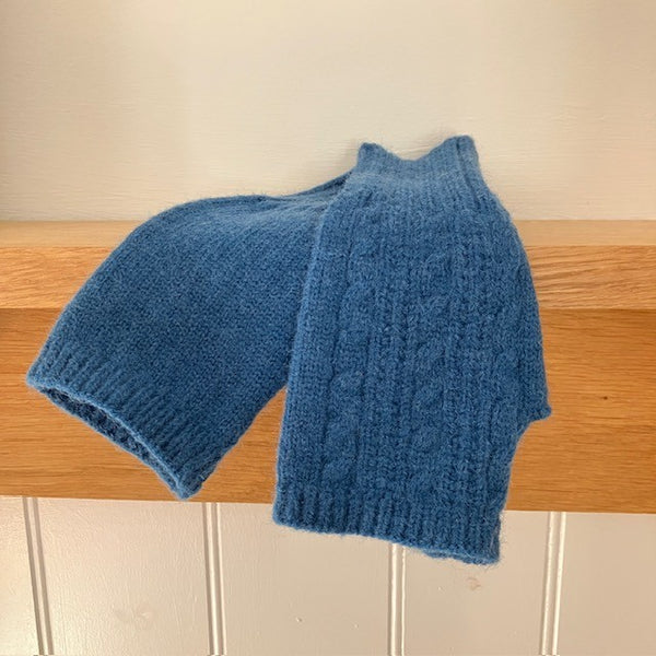 The Agnes Fingerless Gloves have a knitted pattern and keep hands warm and cosy