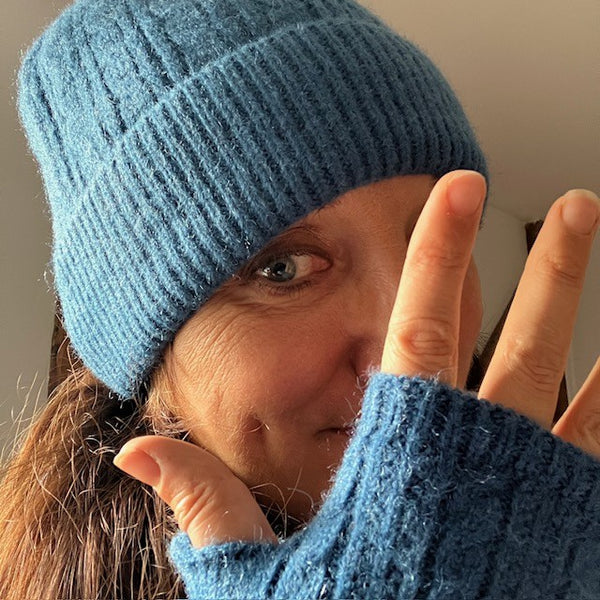 The Agnes Hat & Fingerless Gloves is a gorgeous Denim /  Teal blue colour 