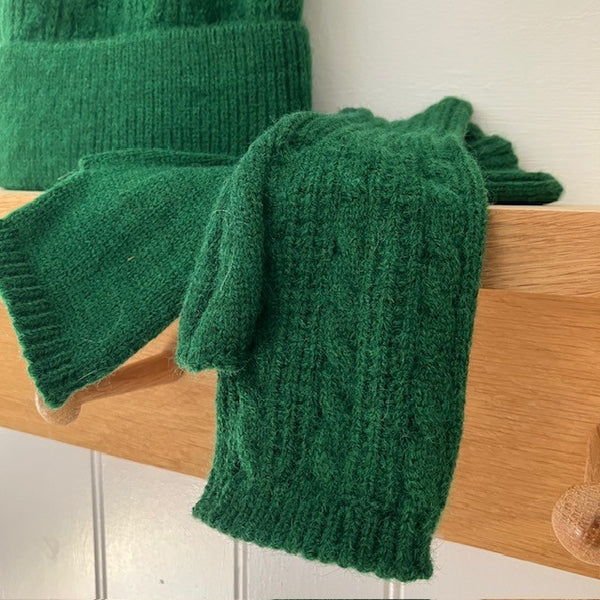 The Agnes Fingerless Gloves have a knitted pattern one side and plain the other
