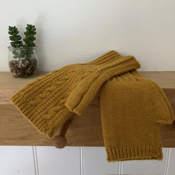 Agnes Knitted Wrist Warmer Gloves Mustard are a super stylish and cosy  fingerless gloves