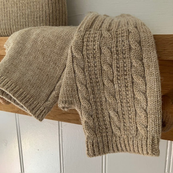 The Agnes Fingerless Gloves are knitted one side and plain the other