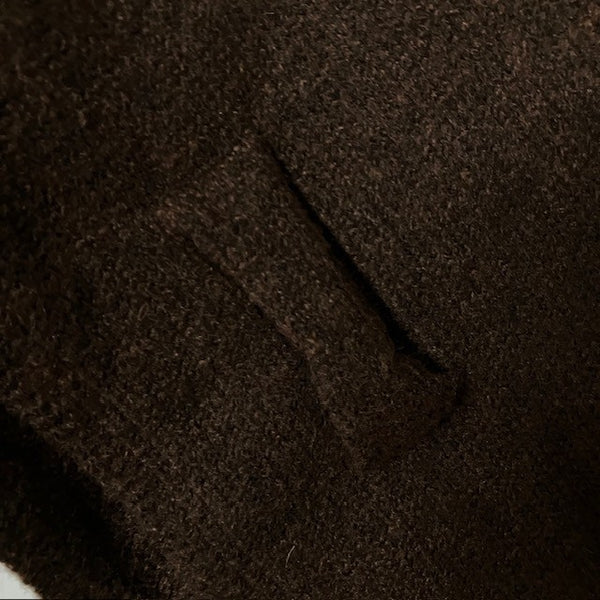 The Aida Scarf Brown has a useful loop feature to secure scarf around your shoulders