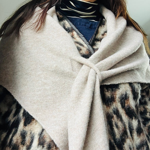 The Aida Scarf Natural can be worn in a cape style in this on-trend triangular shape
