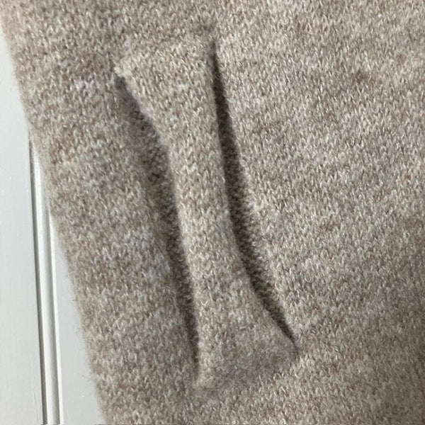 The Aida Scarf Natural has a useful loop to secure the scarf on