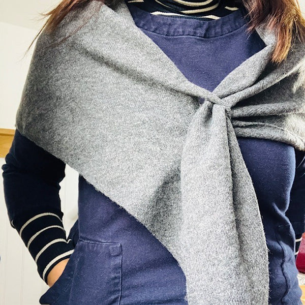 The Aida Scarf Grey sits on the shoulders securely due to the handy little loop feature
