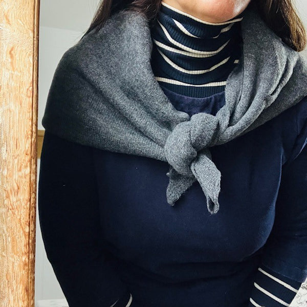 The Aida Scarf Grey adds warmth and comfort to the neck and shoulder area