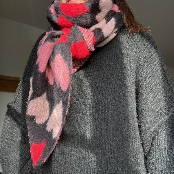The Amora Scarf Black and Red has a gorgeous love heart repeating pattern