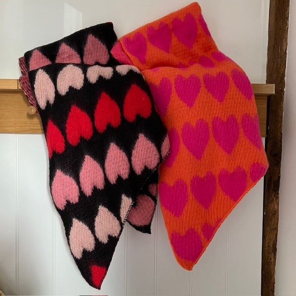 The Amora Scarf is available in either Black and Red or Orange and Pink