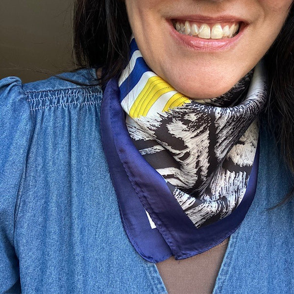 The Babar Scarf Blue is made from polyester and has a soft silk feel