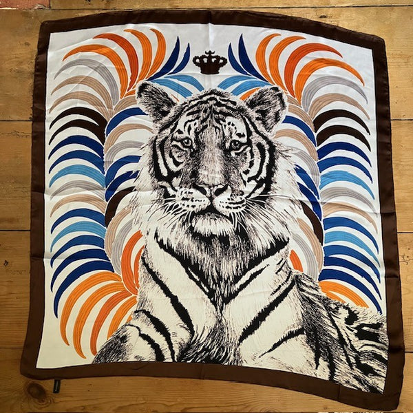 The Babar Scarf is square and has a gorgeous rich brown border all the way around the edge of the scarf