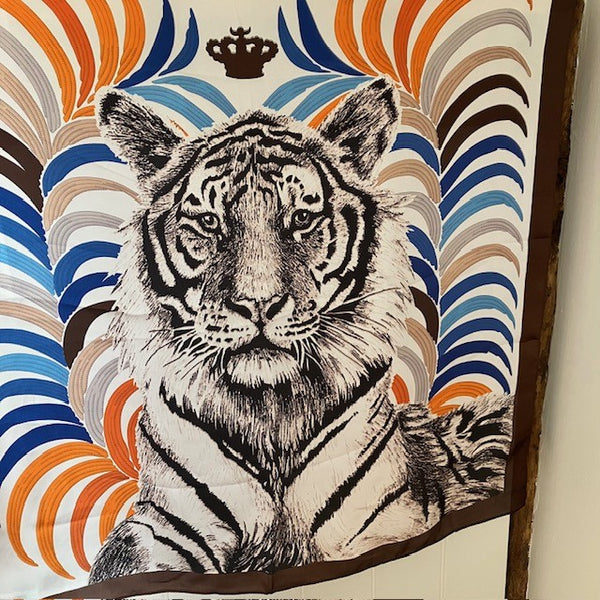 The Babar Scarf is multicoloured in brown, blue and orange colourways 