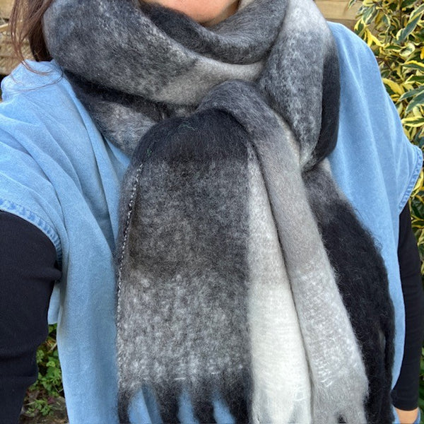 The Bowie Scarf Black, White & Grey is a fabulous, on-trend check scarf ideal to wrap up in to stay cosy and warm on cold days 