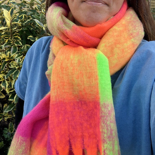The Bowie Scarf Neon Pink, Orange & Yellow in this on-trend large check is ideal to keep you cosy and warm on cold days 
