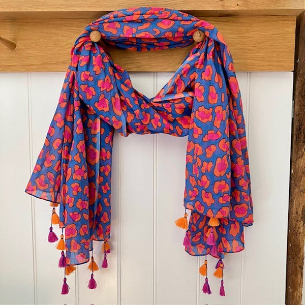 The Cari Scarf Blue is a stunning leopard print scarf, the perfect accessory for bringing a splash of colour to your outfit this summer!