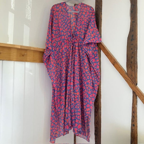 The Cari Kaftan Blue is a stunning leopard print kaftan, the perfect accessory for bringing a splash of colour to your summer!