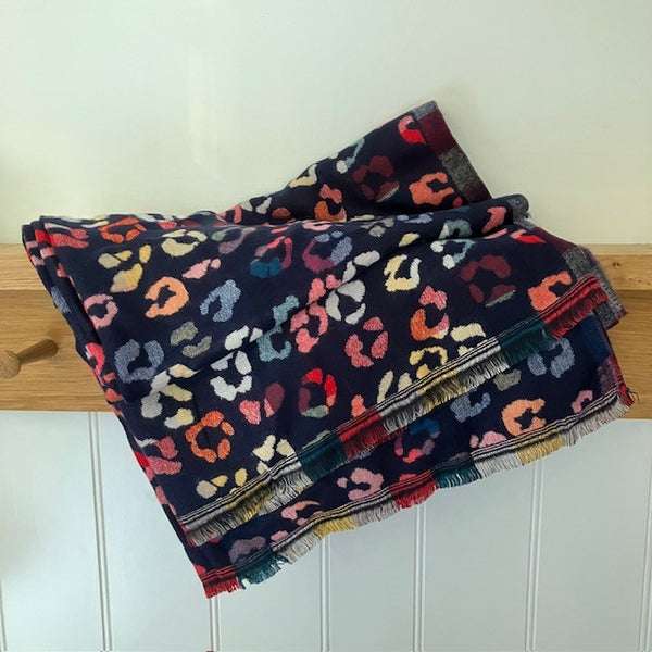 The Cece Navy scarf has a fabulous on trend leopard print pattern in a rainbow of colours, making this a stand out cosy scarf