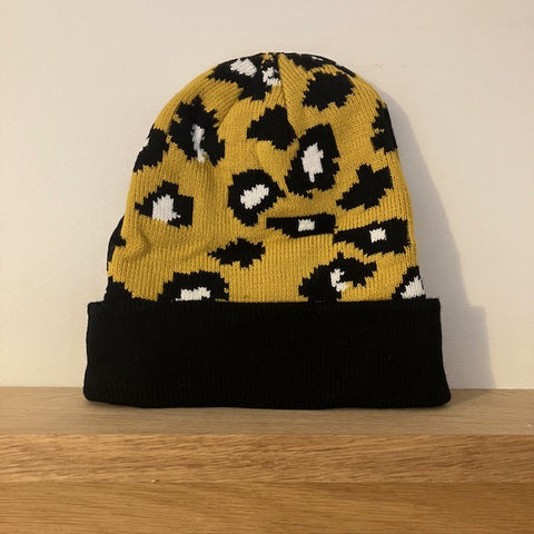 The Cleo Hat Yellow Leopard Print is a fabulous bold design that will keep you super warm and cosy this winter