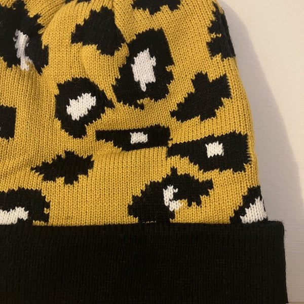 The Cleo Hat Yellow Leopard Print is a fabulous bold design that will keep you super warm and cosy this winter