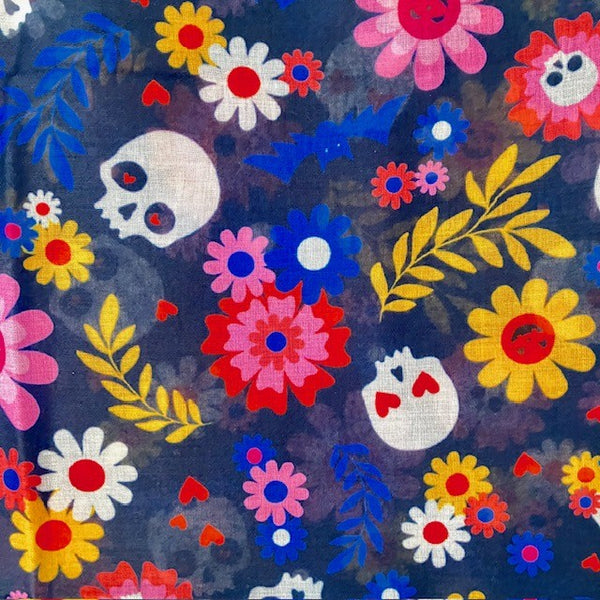 The Coco Scarf has a bold and colourful  Halloween or Day of the Dead pattern
