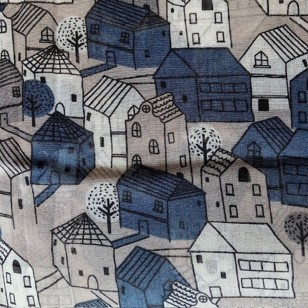 The Cosy Town scarf has a story book house repeating pattern that  makes this a fun and eye catching cosy scarf to wear