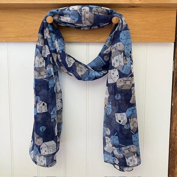 The Cosy Town scarf reminds us of story book houses and the repeating pattern makes this a fun and eye catching cosy scarf to wear