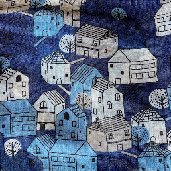 The Cosy Town scarf has a story book house pattern that is eye catching once on