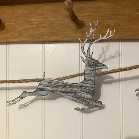 Add this stunning Rustic Reindeer Rope Garland to your cosy home at Christmas time.