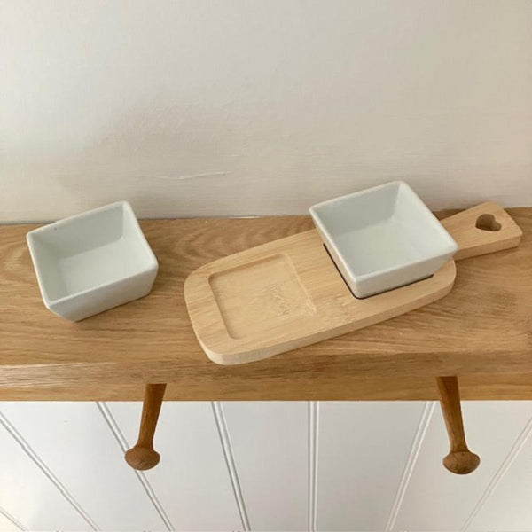 Useful little dipping bowls on a bamboo serving board, perfect for cosy nights in