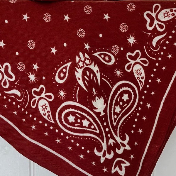 The Dolly Scarf is a gorgeous rich burgundy colour with white stars, dots, floral and paisley pattern