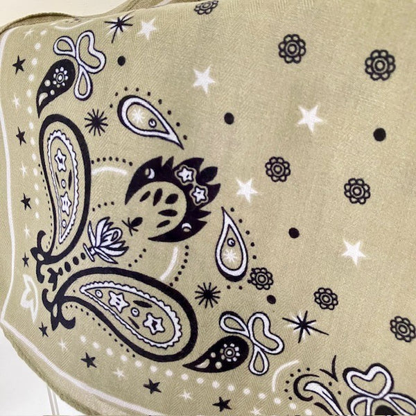 The Dolly Scarf is a gorgeous sage green colourway with black and white star, dot, floral and paisley pattern