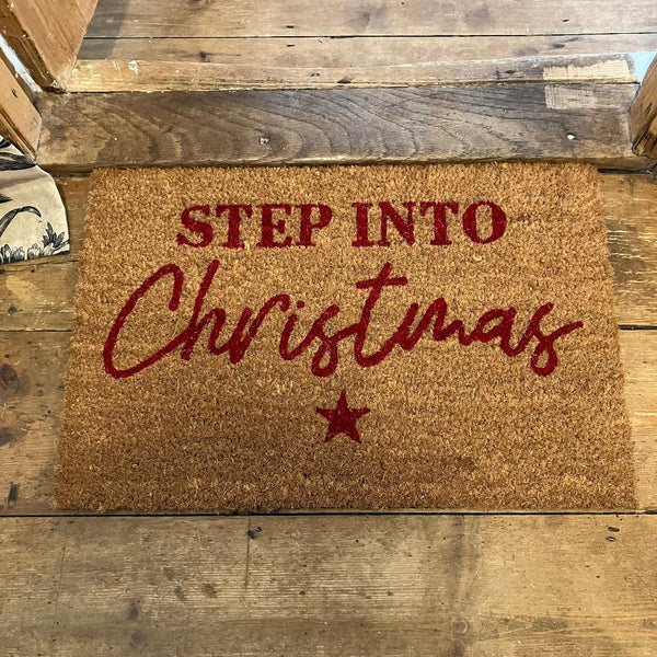 The Cosy Doormat 'Step Into Christmas' will add a warm welcome to your home this festive season